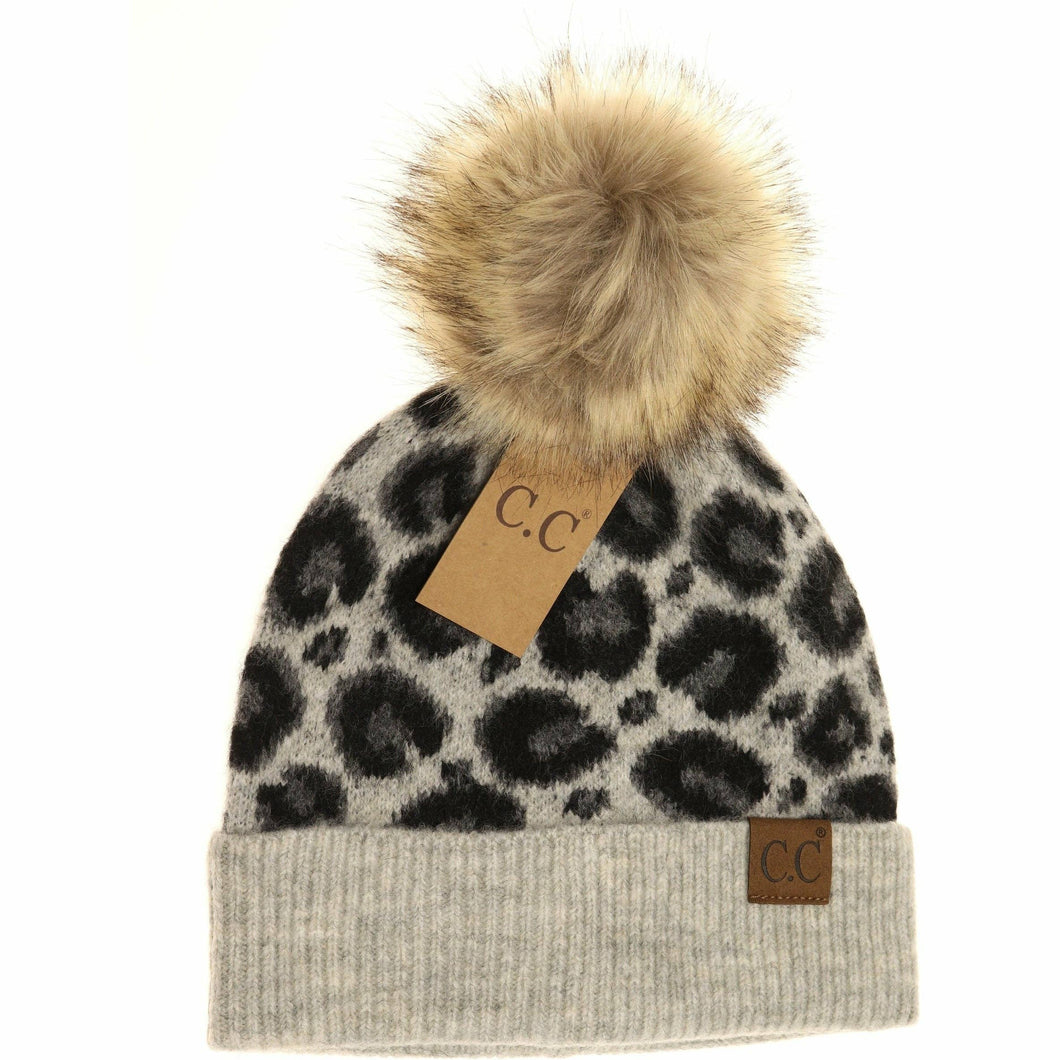 Leopard print beanie with fur pom-pom and C.C branding on a white background