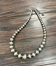 Load image into Gallery viewer, Silver beaded necklace on a wooden surface