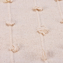 Load image into Gallery viewer, Close-up of a textured beige fabric with knotted details