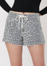 Load image into Gallery viewer, Person wearing gray leopard print shorts on a white background