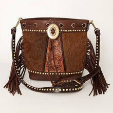 Load image into Gallery viewer, Brown leather handbag with fringe and decorative buckle on a white background