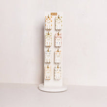 Load image into Gallery viewer, Earring display stand with multiple pairs of earrings on a white background