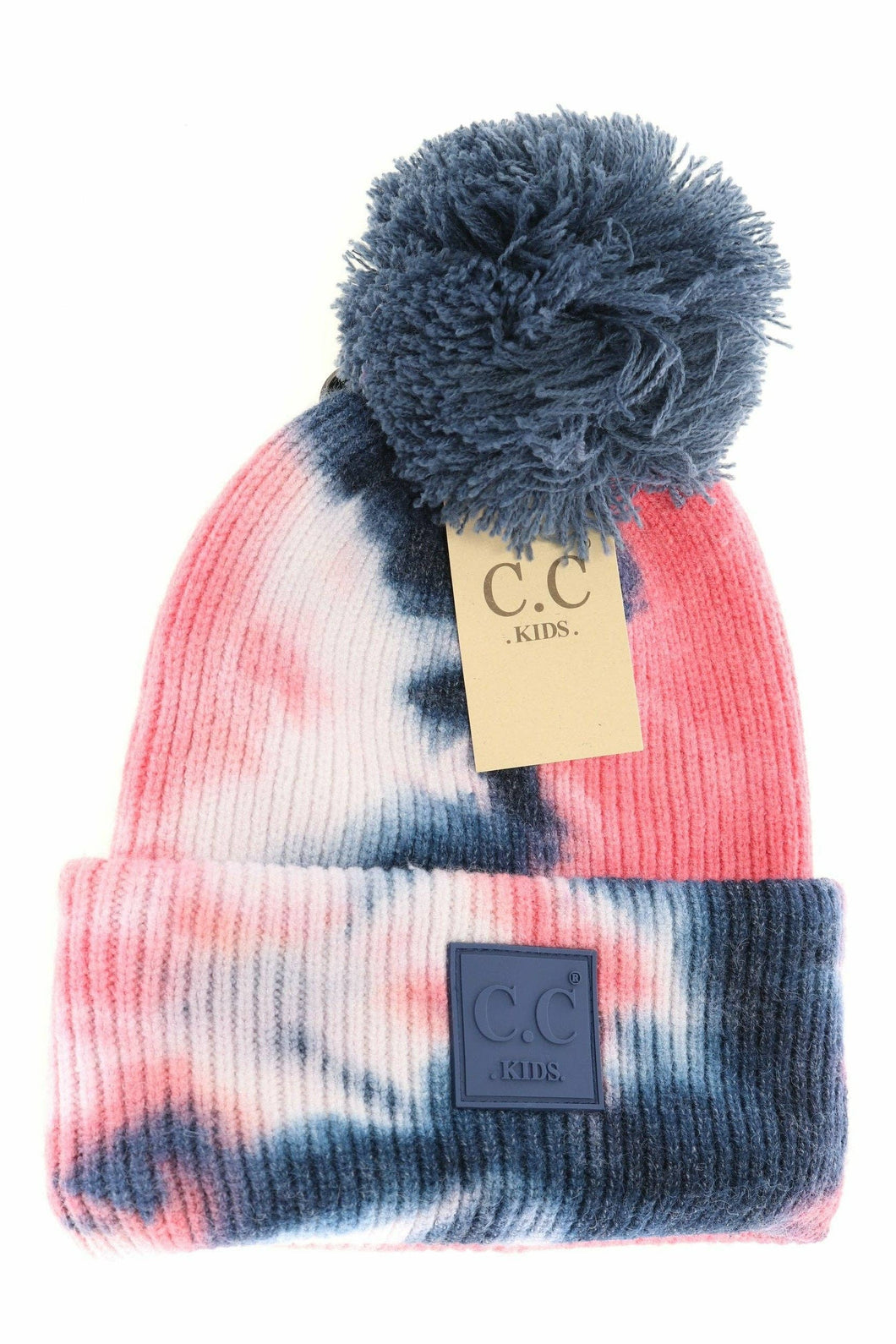 Tie-dye beanie with pom-pom and C.C tag on a white background