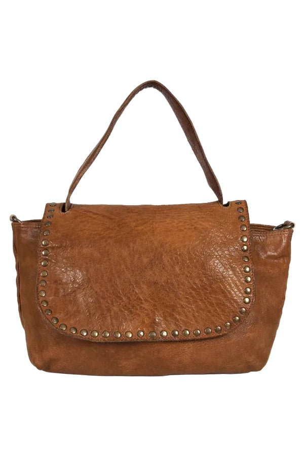 Brown leather handbag with studs on a white background