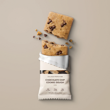 Load image into Gallery viewer, Chocolate chip cookie dough bar with packaging on a beige background