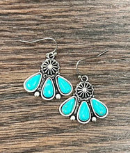 Load image into Gallery viewer, Turquoise teardrop earrings with silver floral designs on a wooden surface