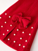 Load image into Gallery viewer, Red fabric with white polka dots and a red bow on a white background