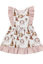 Load image into Gallery viewer, Children's dress with musical instrument pattern on a white background