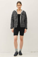 Load image into Gallery viewer, Person wearing a gray quilted jacket and black shorts on a white background