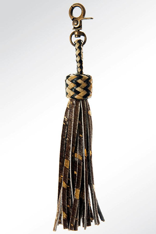 Tassel keychain with braided design on a white background
