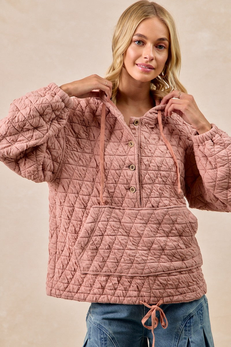 Woman wearing light link quilted hoodie