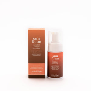 Sun foam sunless tanning mousse with packaging on a white background