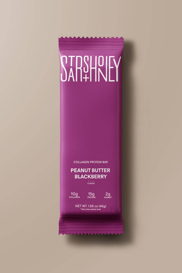 Purple protein bar packaging with 'Sashimi' branding on a beige background