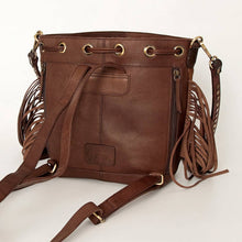 Load image into Gallery viewer, Brown leather handbag with decorative straps on a white background