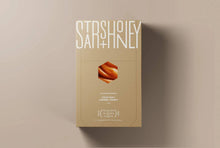 Load image into Gallery viewer, Caramel product packaging with 'Starshoney' branding on a beige background