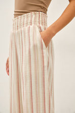 Load image into Gallery viewer, Striped pants worn by a person on a plain background