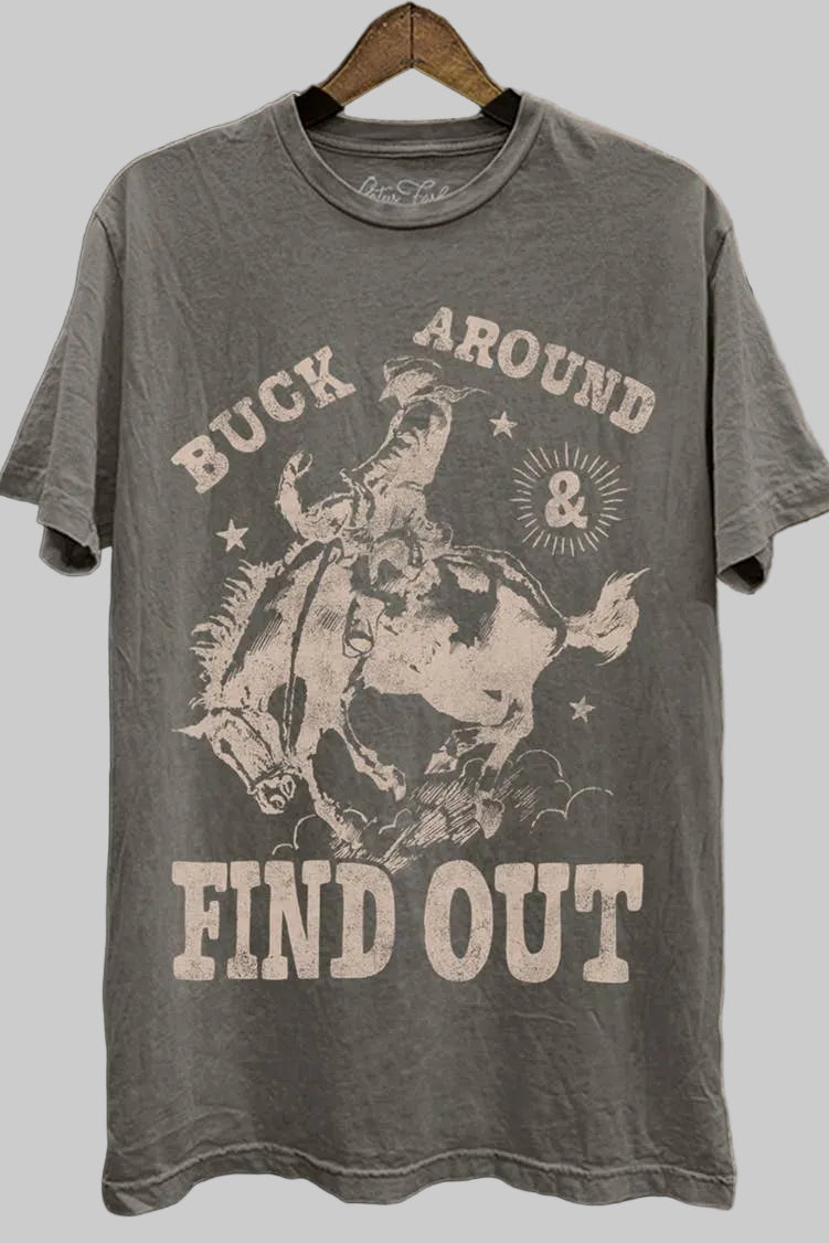 Gray t-shirt with graphic design and text on a wooden background