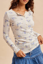 Load image into Gallery viewer, Woman wearing a floral long-sleeve shirt and denim skirt with a brown hat on a beige background