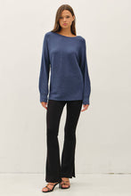 Load image into Gallery viewer, Woman wearing a blue sweater and black pants on a white background
