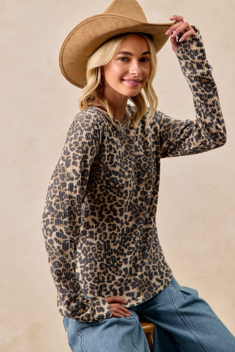woman wearing leopard top