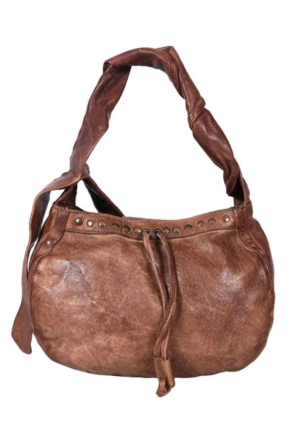 Brown leather handbag with studded details on a white background