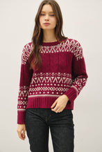 Load image into Gallery viewer, Woman wearing a red patterned sweater against a plain background