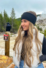 Load image into Gallery viewer, Woman with long blonde hair wearing a headband in a natural setting with trees and mountains.
