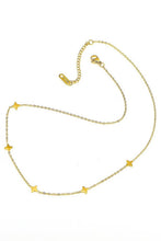Load image into Gallery viewer, Gold necklace with star-shaped pendants on a white background