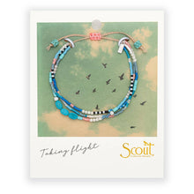 Load image into Gallery viewer, Beaded bracelet on a Scout branded card with a map background