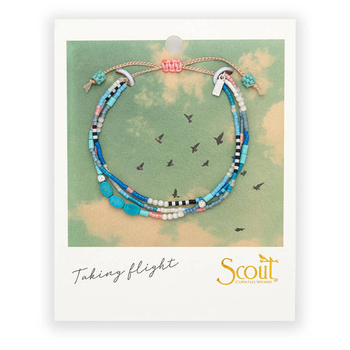 Beaded bracelet on a Scout branded card with a map background