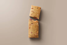 Load image into Gallery viewer, Two rectangular cookie bars with visible chunks on a beige background