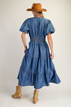 Load image into Gallery viewer, Woman wearing a blue denim dress with a brown hat and boots on a plain background