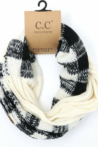 Black and white infinity scarf with a C.C Exclusives tag on a white background