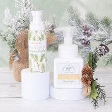 Load image into Gallery viewer, Two bottles of Aller-Magic products on a white surface with a decorative background featuring pine branches and pinecones.
