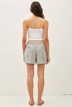Load image into Gallery viewer, Woman wearing a white tank top and striped shorts on a plain background