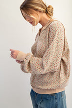 Load image into Gallery viewer, Woman wearing a floral blouse and jeans on a plain background