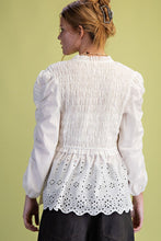 Load image into Gallery viewer, White blouse with intricate detailing on a plain background
