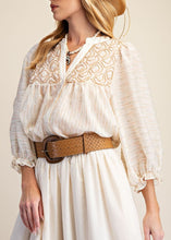 Load image into Gallery viewer, Woman wearing a white dress with lace details, a straw hat, and a brown belt against a plain background