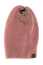 Load image into Gallery viewer, Pink knitted beanie with a brown tag on a white background