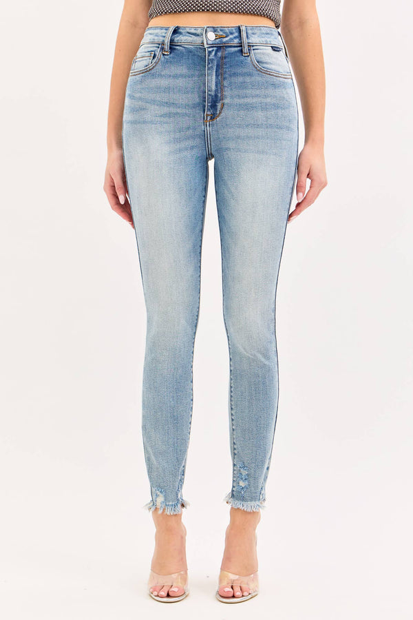 Light blue jeans worn by a person on a white background