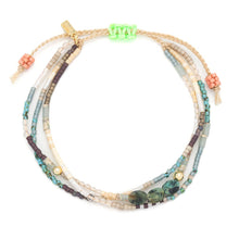 Load image into Gallery viewer, Multistrand beaded bracelet with colorful beads on a white background