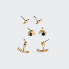 Load image into Gallery viewer, Set of gold earrings on a light gray background