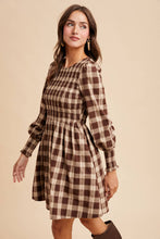 Load image into Gallery viewer, Woman wearing a plaid dress with long sleeves on a beige background