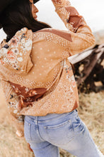 Load image into Gallery viewer, Person wearing a patterned jacket and jeans in an outdoor setting