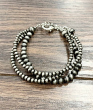 Load image into Gallery viewer, Two silver beaded bracelets on a wooden surface