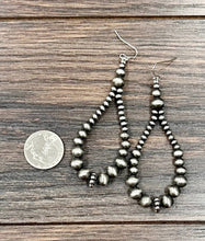Load image into Gallery viewer, Pair of silver beaded earrings on a wooden surface with a coin for scale.