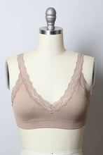 Load image into Gallery viewer, Beige bra with lace details on a mannequin against a plain background