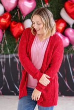 Load image into Gallery viewer, woman wearing red cardigan with valentine background