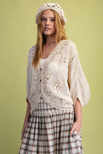 Load image into Gallery viewer, Woman wearing a white lace top and plaid skirt against a green background