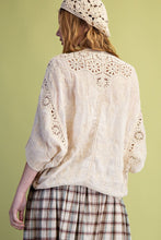 Load image into Gallery viewer, Woman wearing a white lace top and plaid skirt against a green background